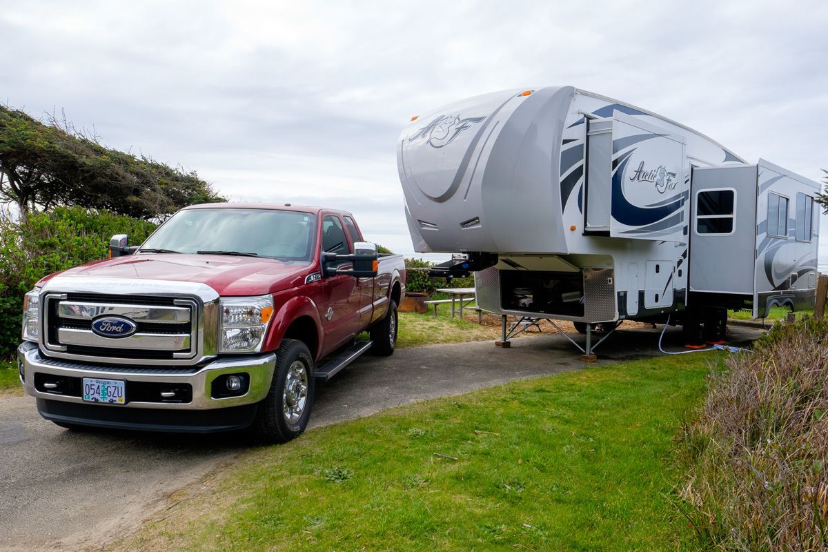 Life is good camping logo with 5th wheel deals trailer