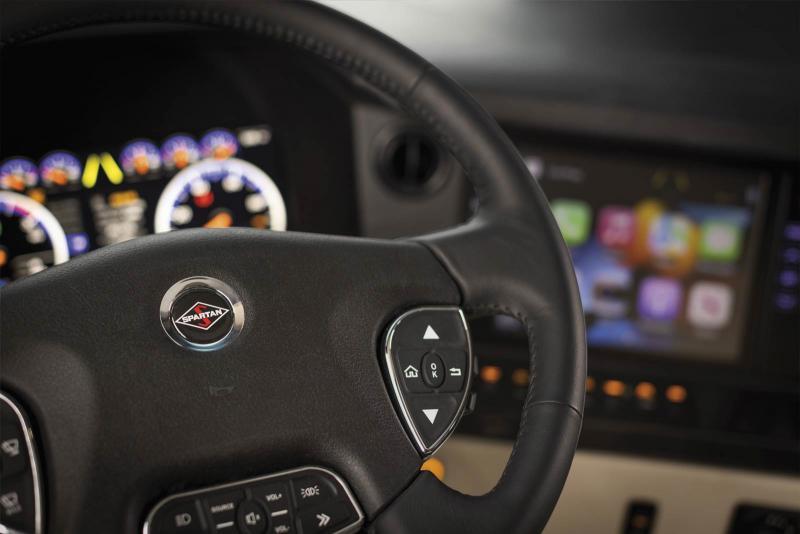 Up close view of the steering wheel inside a 2023 Newmar Essex Class A RV