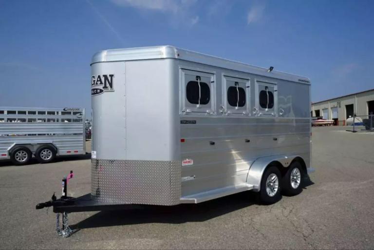 Logan Coach bumper pull trailer in a parking lot