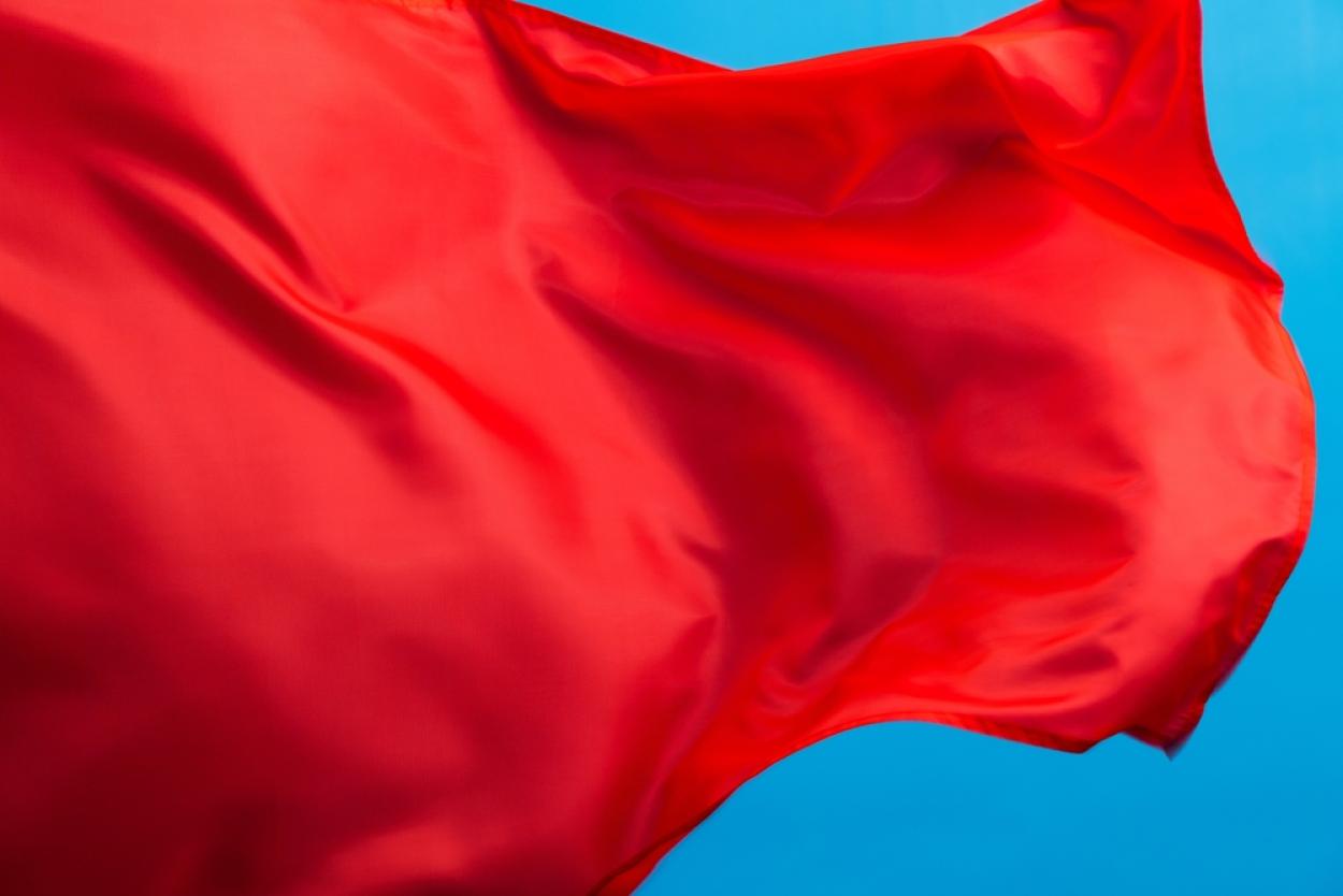 Red flag on a blue background