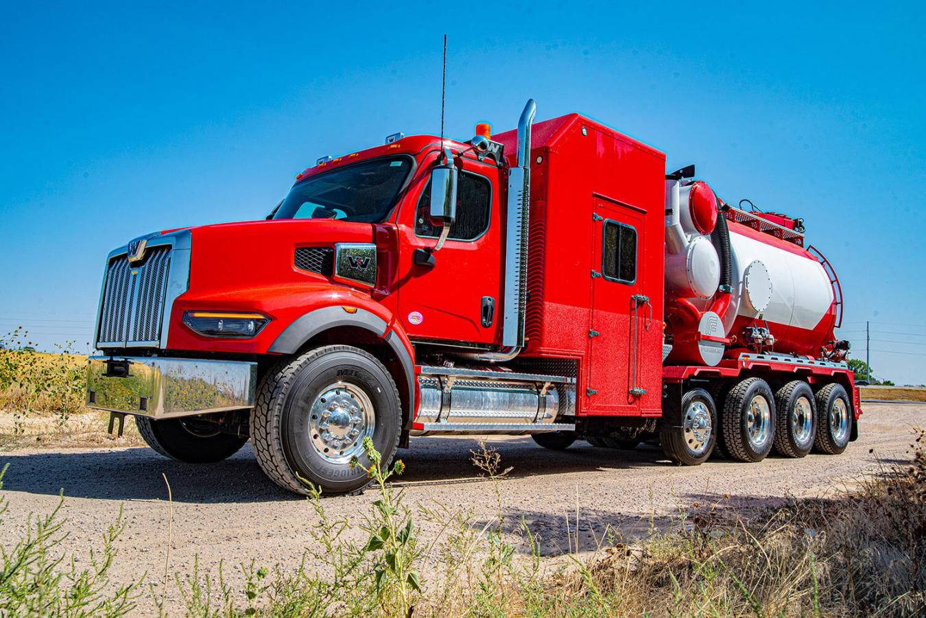 Red Foremost hydrovac truck in front of blue sky