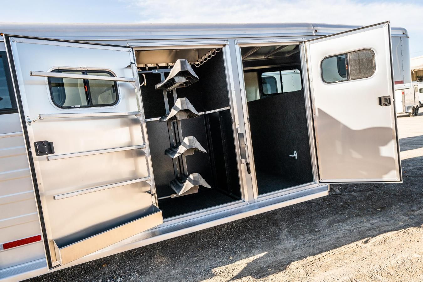 An exterior shot of a Logan Coach Trailer with its side doors open