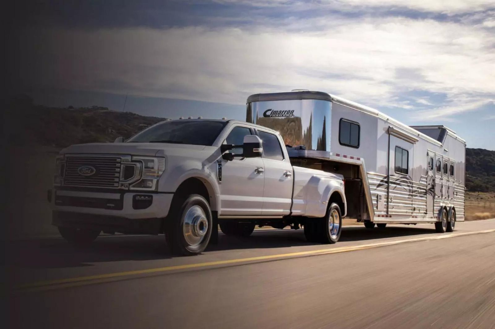 A front exterior shot of a truck hauling a Cimarron Trailer