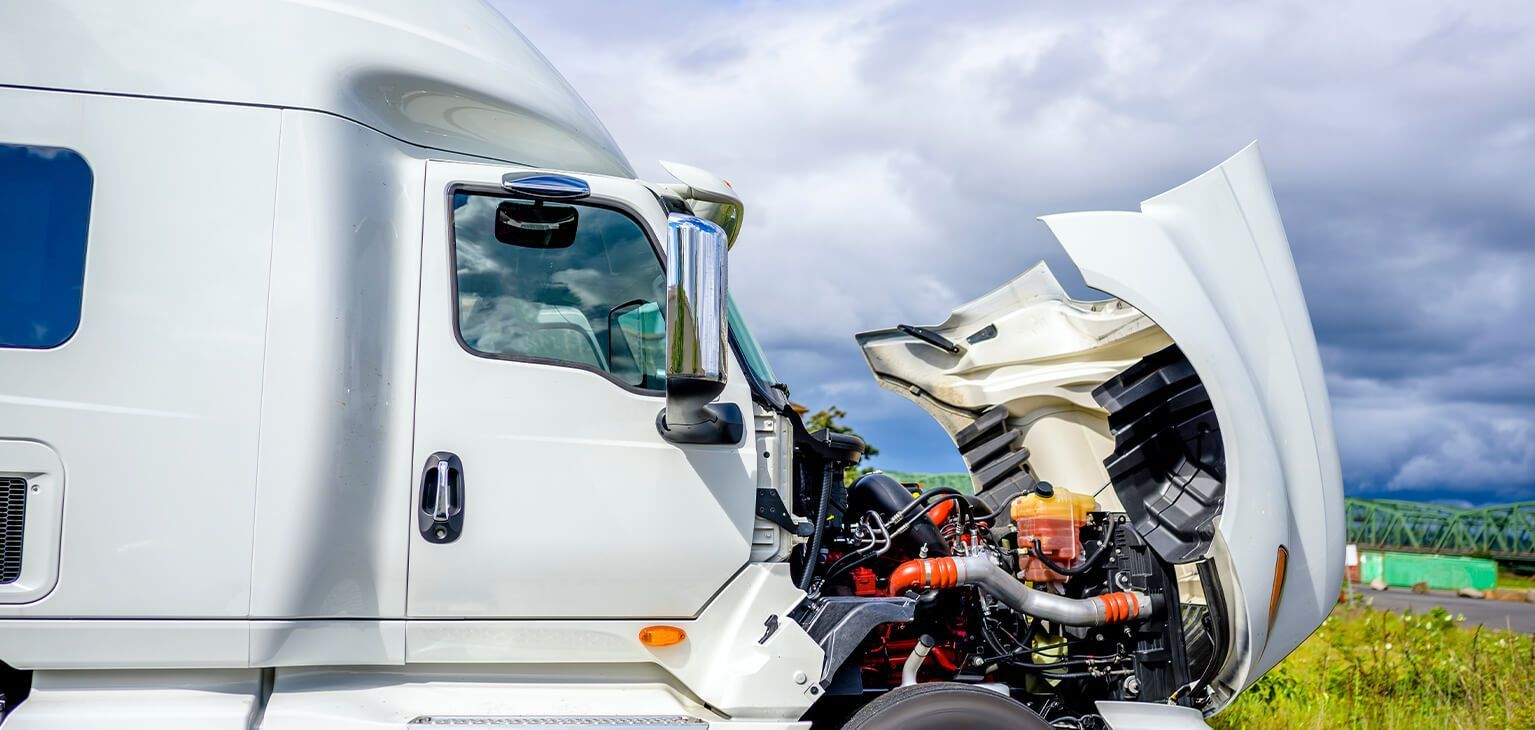 White truck with open hood