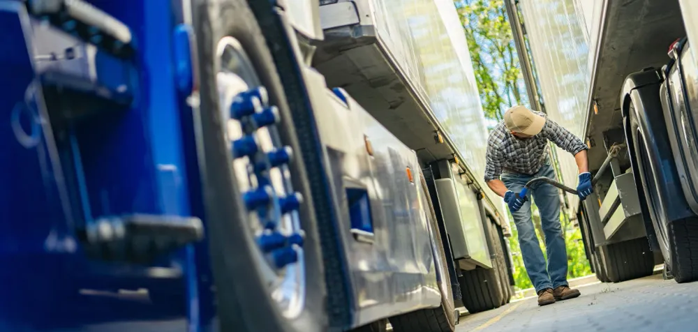 A man servicing a commercial trailer