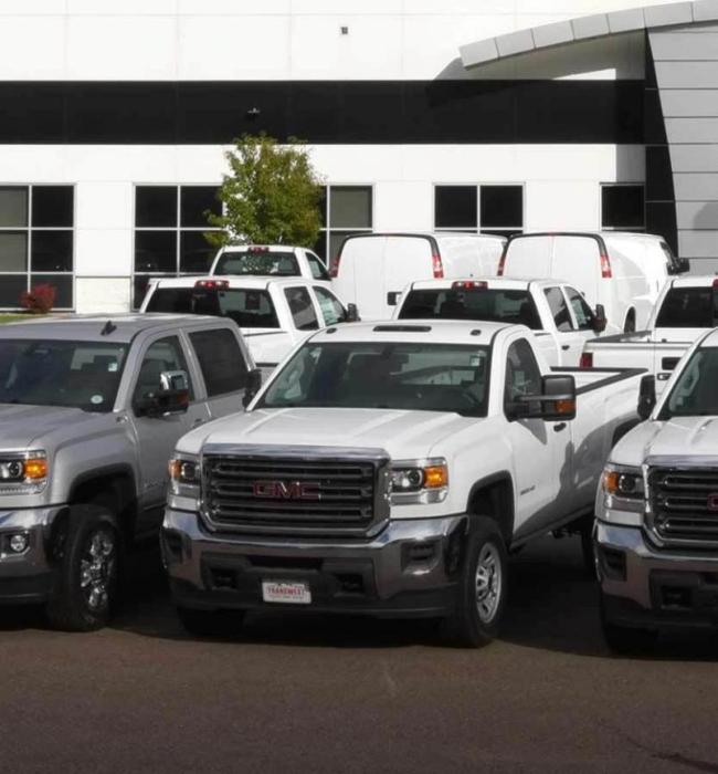 Parking lot with many pickup trucks