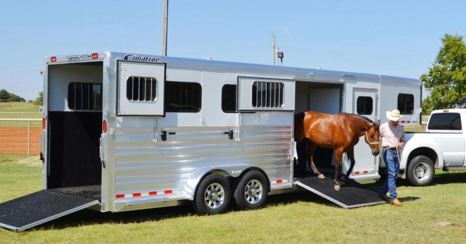 Man unloading a horse trailer