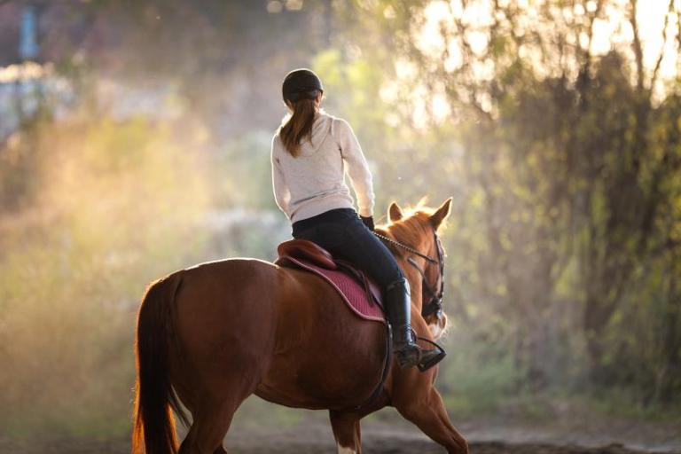 Woman riding a horse